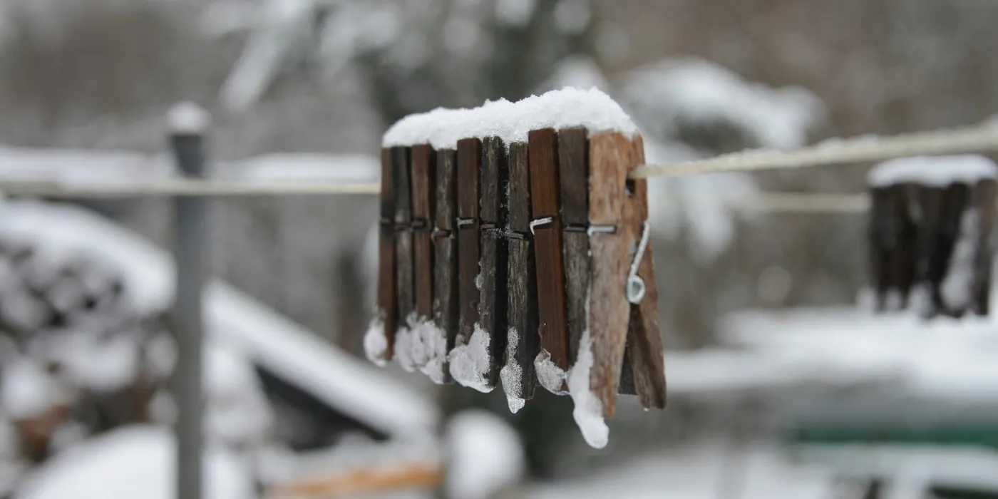 clothesline in the winter with snow on it
