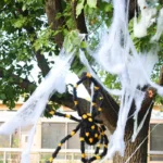 fake spider webs on a tree