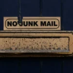 mail slot with a no junk mail sign