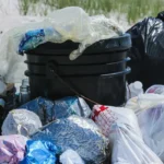 plastic bags and trash on a beach