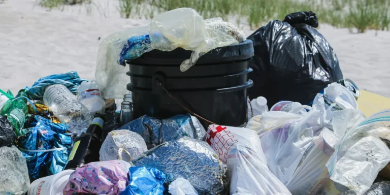 plastic bags and trash on a beach
